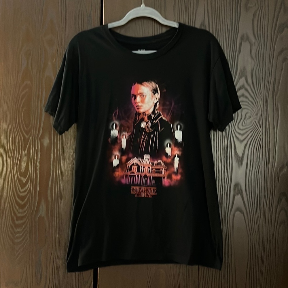 Netflix Stranger Things black top with picture on the front. Size Medium.